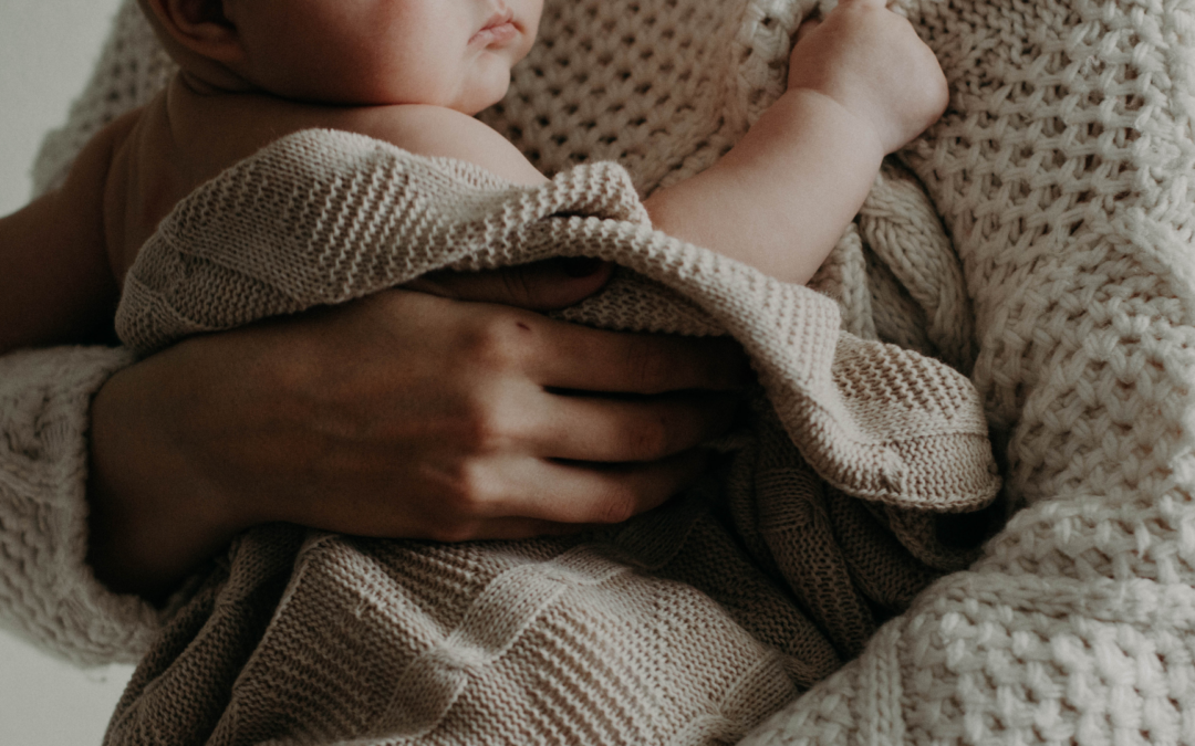 mother holding baby